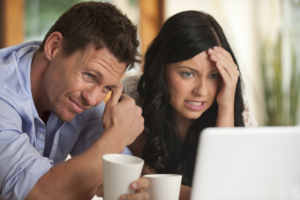 Worried Couple looking at latest rates