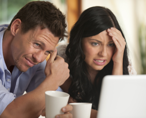 Worried Couple looking at latest rates