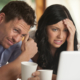 Worried Couple looking at latest rates