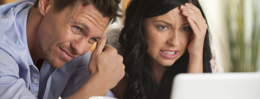 Worried Couple looking at latest rates